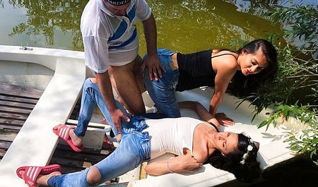 Des copines montent avec un mec de Détroit le long de la rivière et font du sexe en groupe au grand air